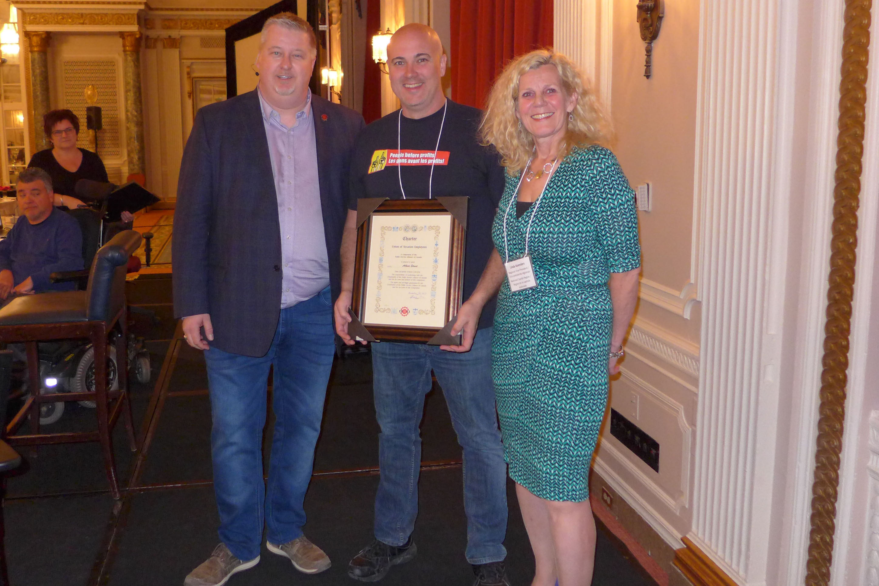 National President, Marc Brière and Linda Koenders, RVP for the NCR present Scott Henneberry, President of Local 70022 - Albert Street, with the Local's Charter