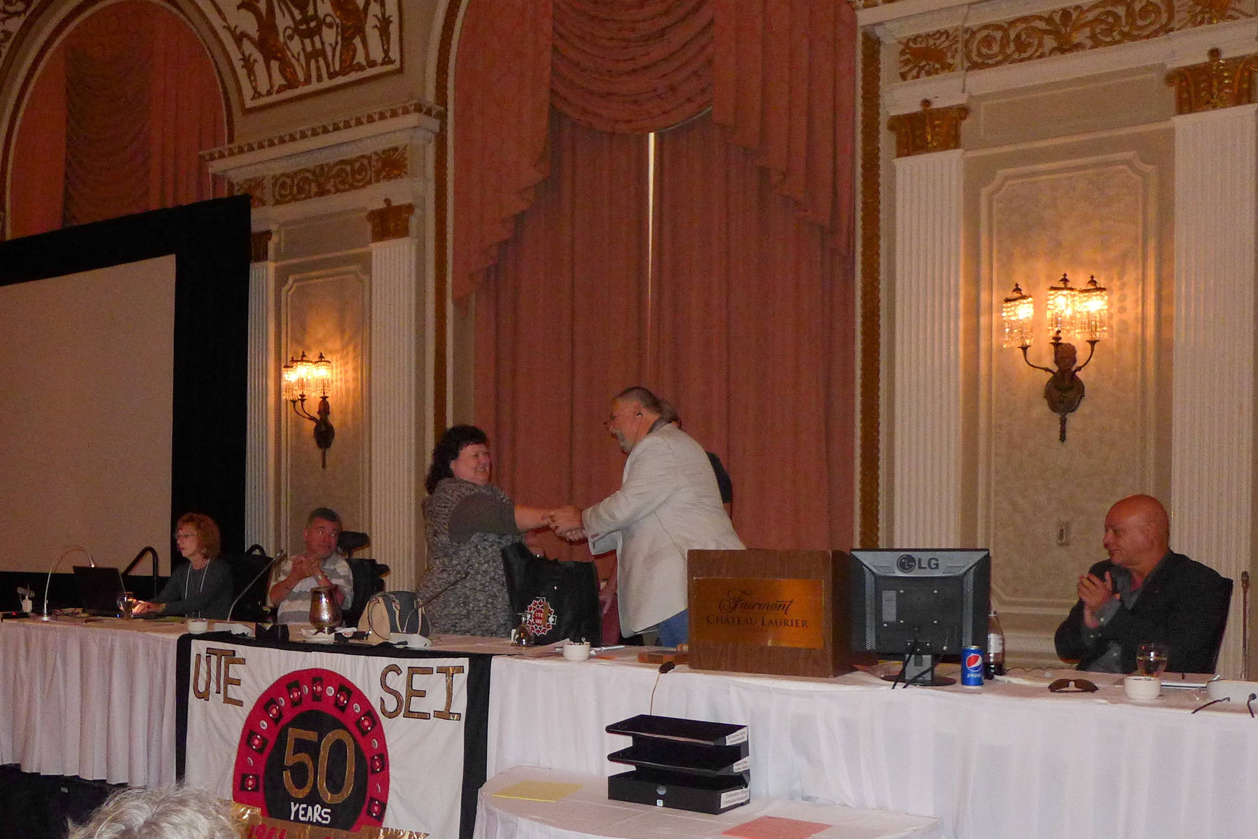 Dale Robinson receives a UTE gift from Robert Campbell