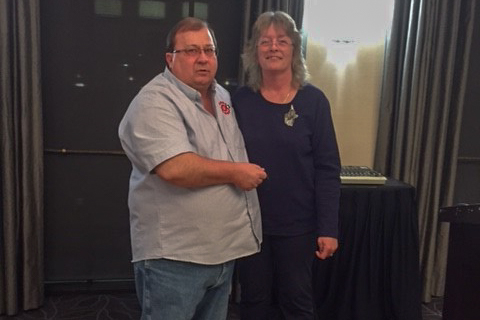 June Martin-Gendron is presented her 10 year pin by RVP Greg Krokosh